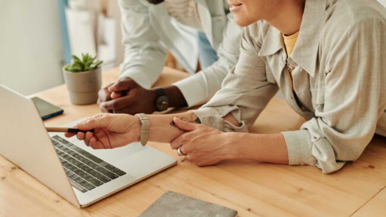 Business people working with online project on laptop