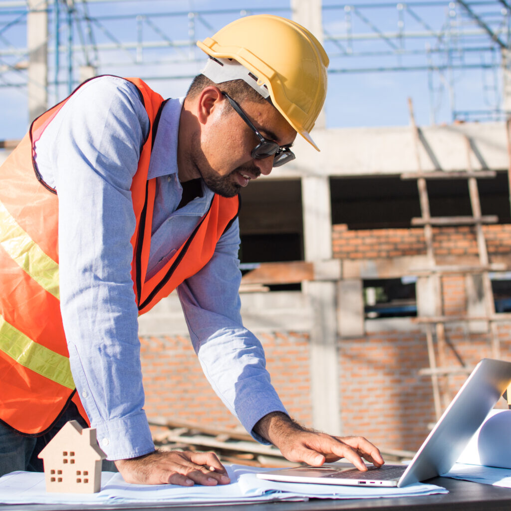 Irish construction worker reviewing digital project data onsite