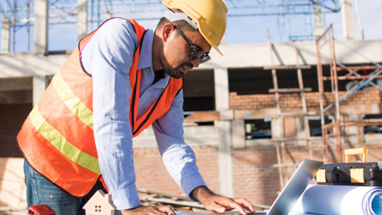 Irish construction worker reviewing digital project data onsite
