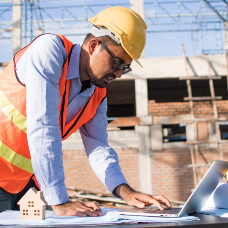 Irish construction worker reviewing digital project data onsite