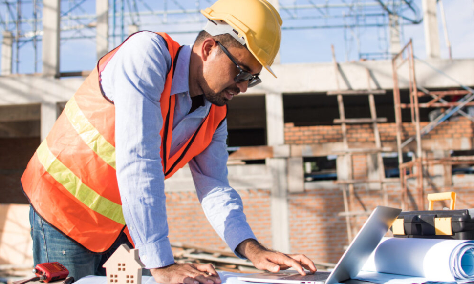 Irish construction worker reviewing digital project data onsite